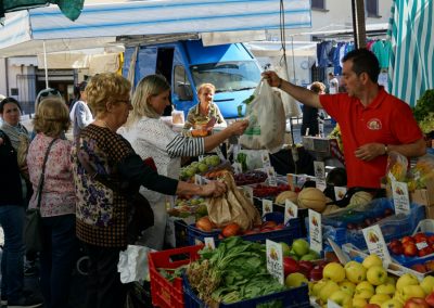 Food and wine tour guests shopping at an Orvieto market.