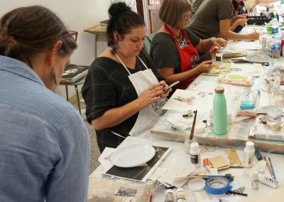 Art workshop guests crafting journals on an Orvieto tour.
