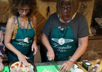 Food tour guests making pizza at Zeppelin Orvieto.