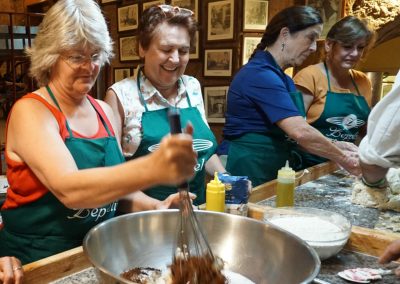 Food tour guests enjoying a cooking class in Orvieto.