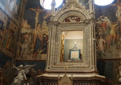 A colorful Renaissance fresco depicting a biblical miracle on a cathedral wall.